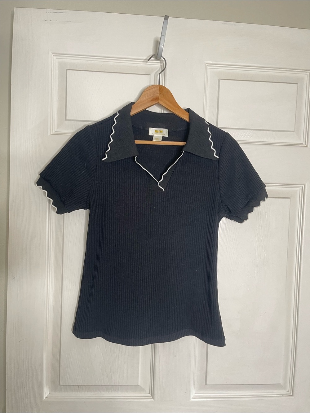 Anthropologie Black Ribbed Polo Top with White Scalloped Trim quiet luxury